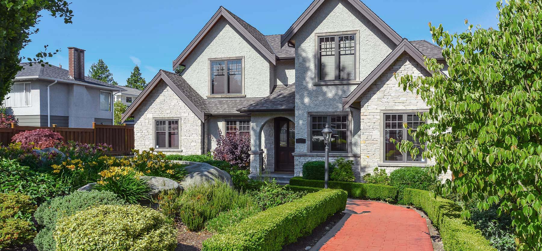 Home exterior being checked while performing home inspection services